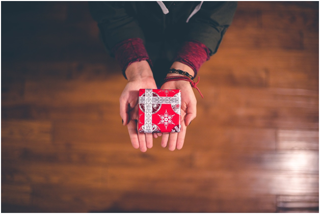 wrapped gift in person's hand